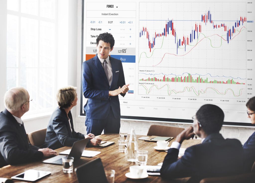 a group of people around a table having a meeting discussion to Boost E-Commerce Sales