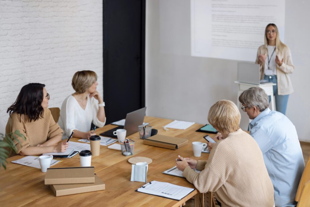 a group of people having a discussion as an Offshored sales team