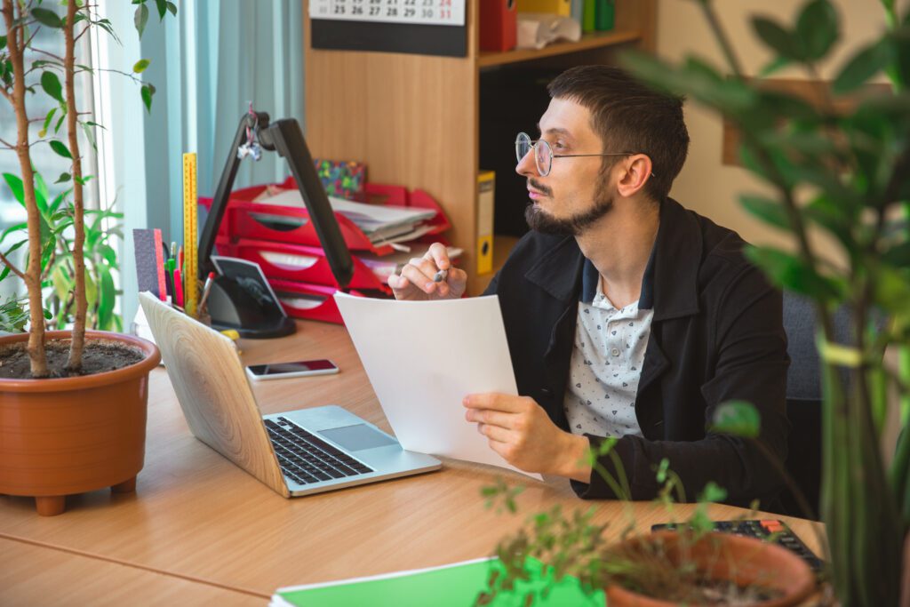 Caucasian entrepreneur, businessman, manager working concentrated in office understanding EOR gig economy