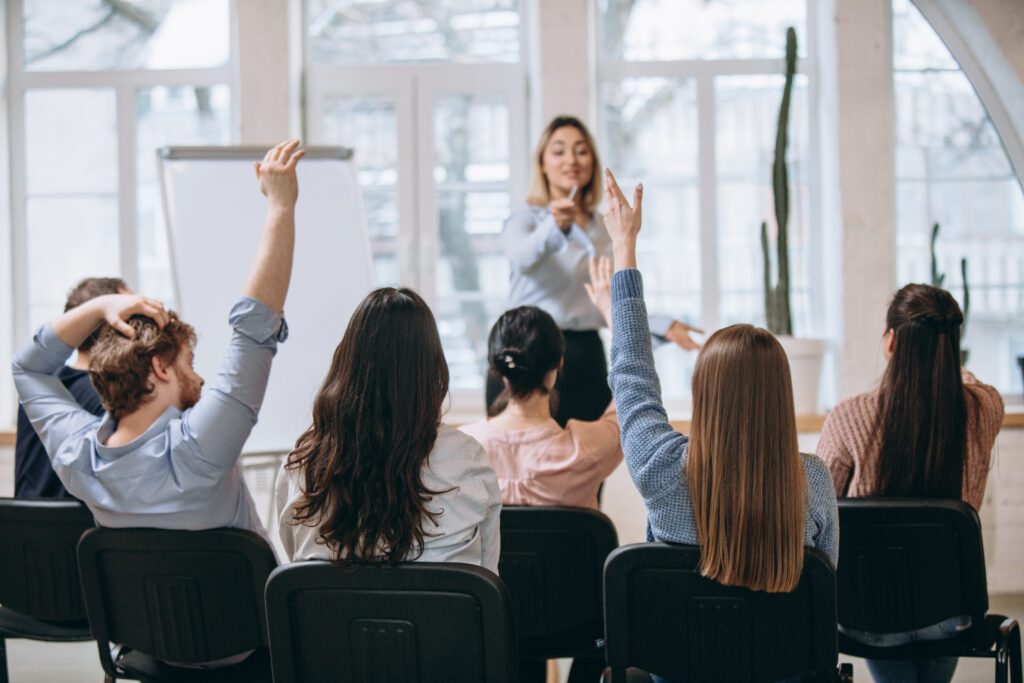 female speaker giving presentation about software development fundamentals