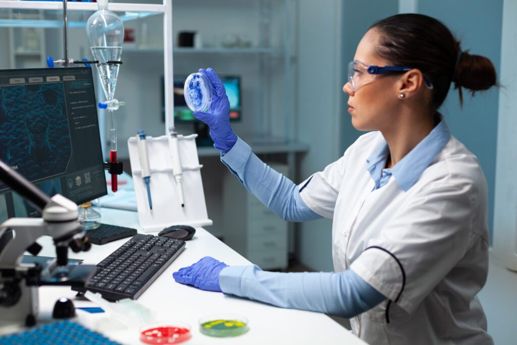 clinical research staff holding petri dish