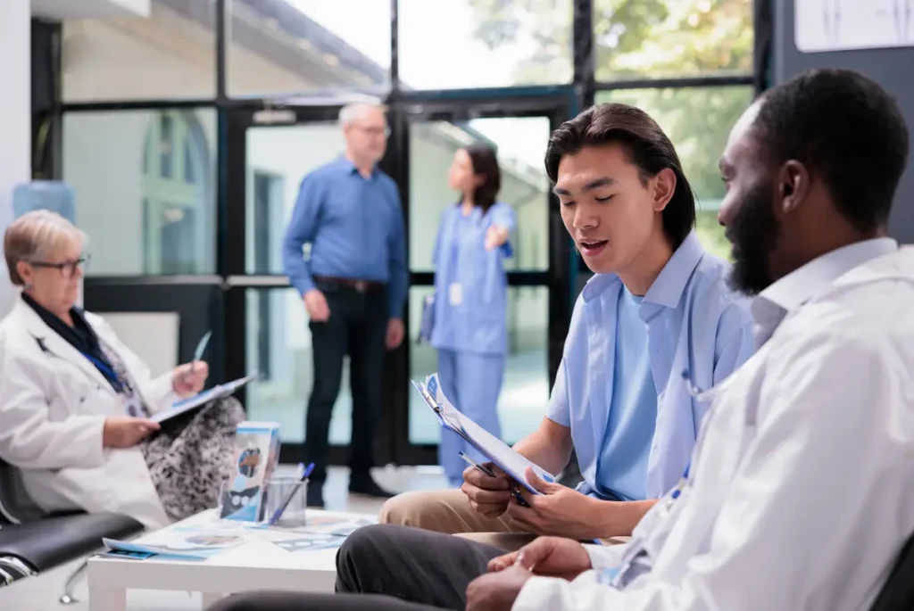 clinical trial professional speaking with patient