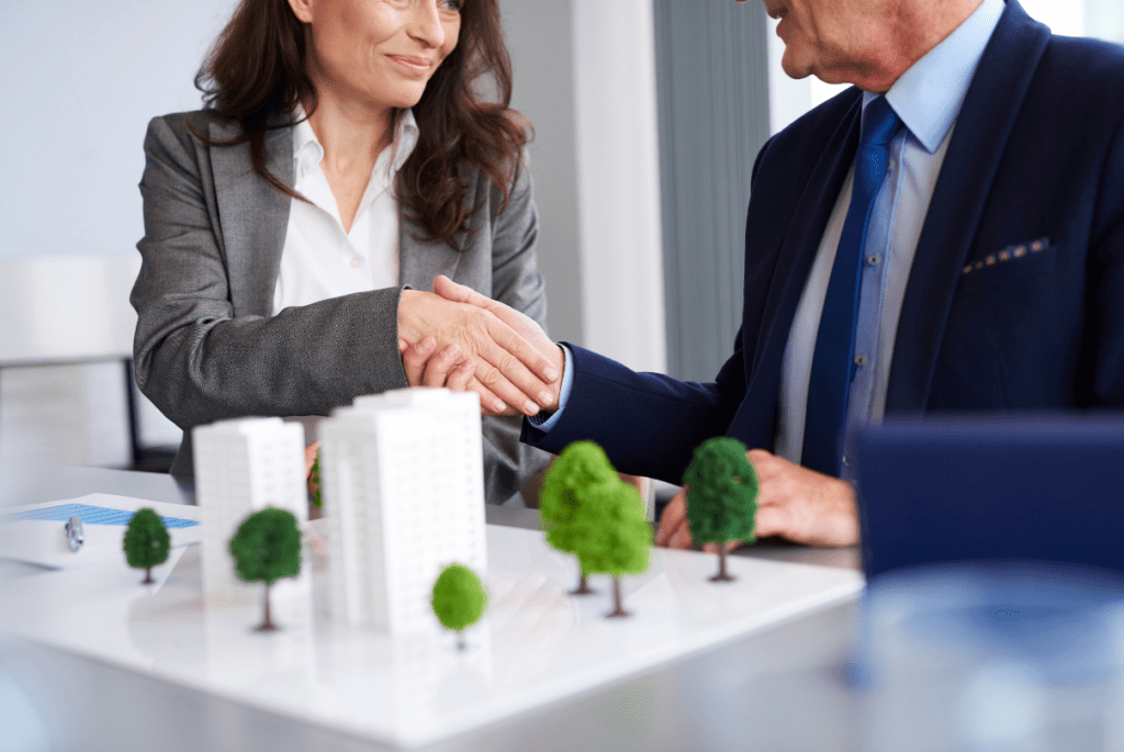 two real estate bpo services employees shaking hands