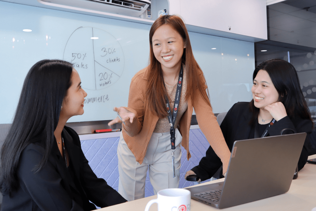 A professional woman dressed in a black blazer, symbolizing remote recruitment in the Philippine education sector.