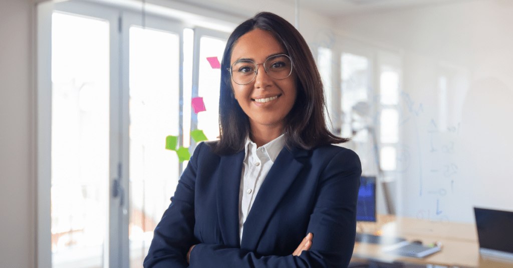 Female employee for philippines tax compliance with eyeglasses arms crossed