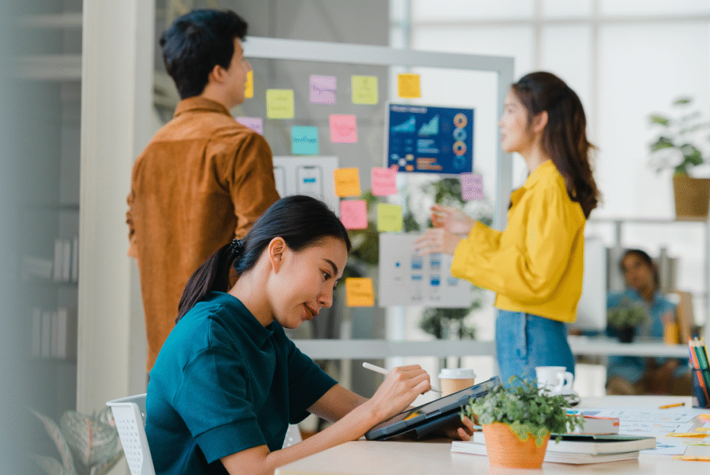 A diverse group of professionals collaborating in a modern office setting, emphasizing employer branding in the Philippines.